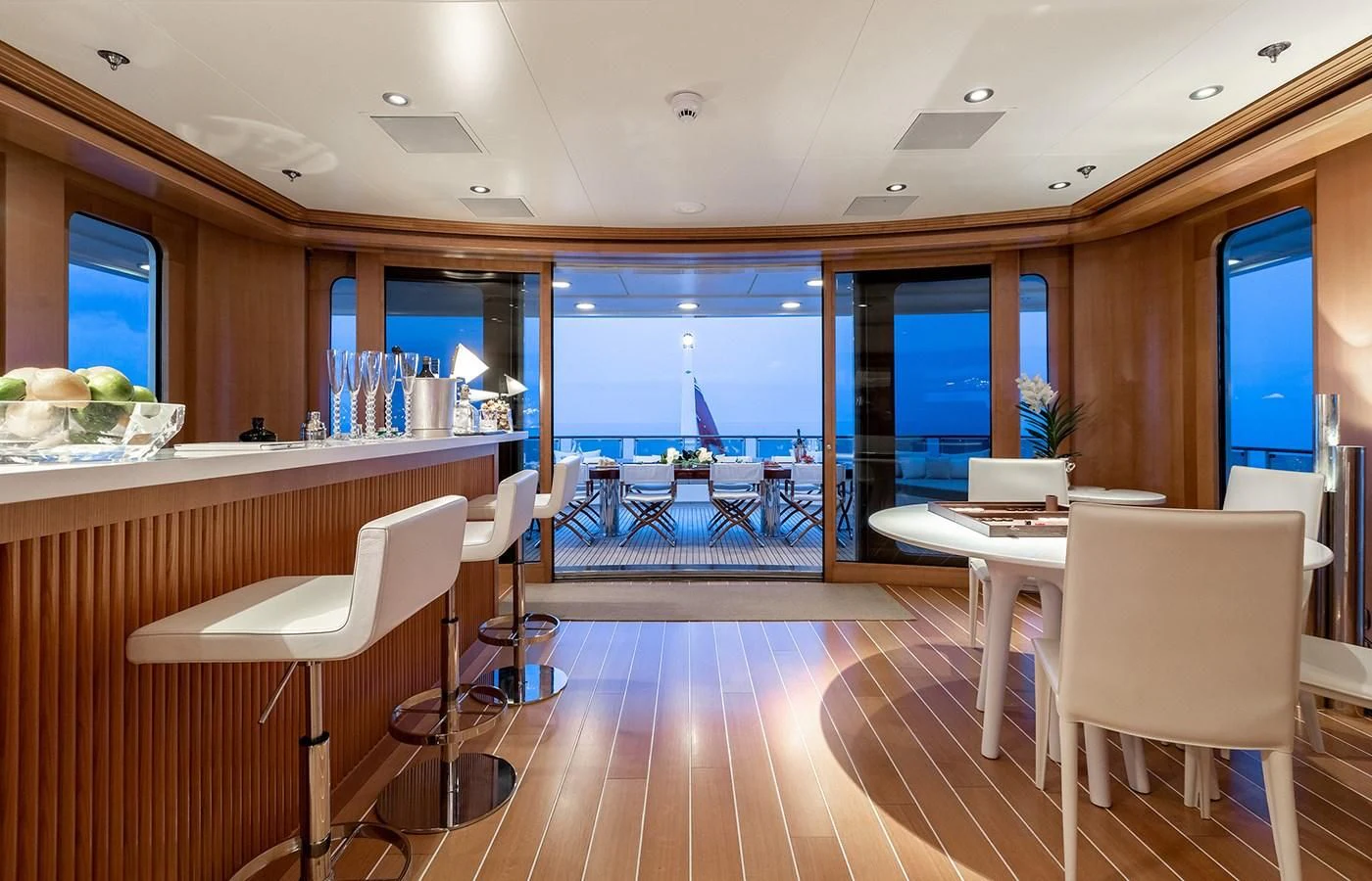 a room with tables and chairs aboard TREEHOUSE Yacht for Sale