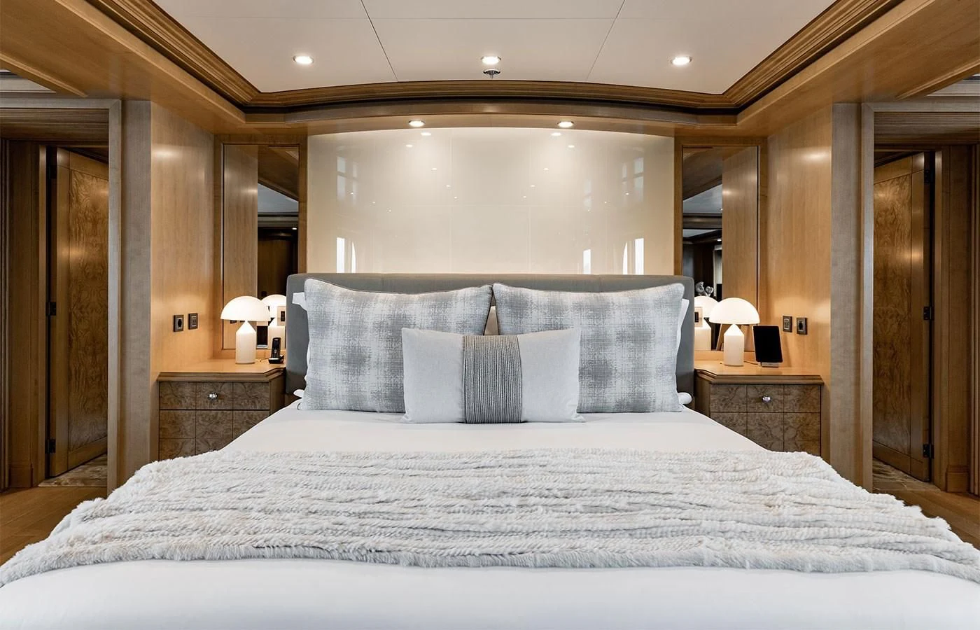 a bed with white sheets aboard TREEHOUSE Yacht for Sale