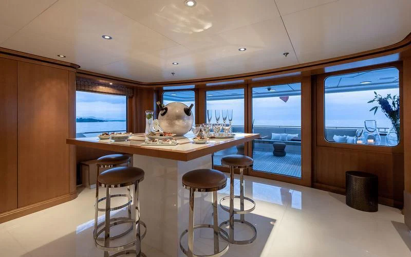 a large kitchen with stools aboard TREEHOUSE Yacht for Sale
