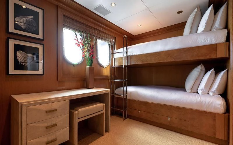 a bed in a room aboard TREEHOUSE Yacht for Sale