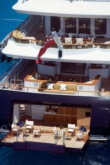 a boat with tables and chairs aboard TREEHOUSE Yacht for Sale