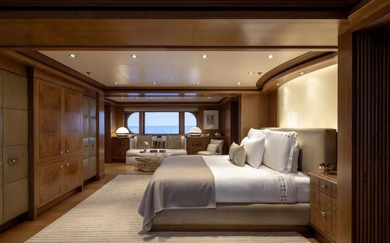 a room with a bed and a wood door aboard TREEHOUSE Yacht for Sale