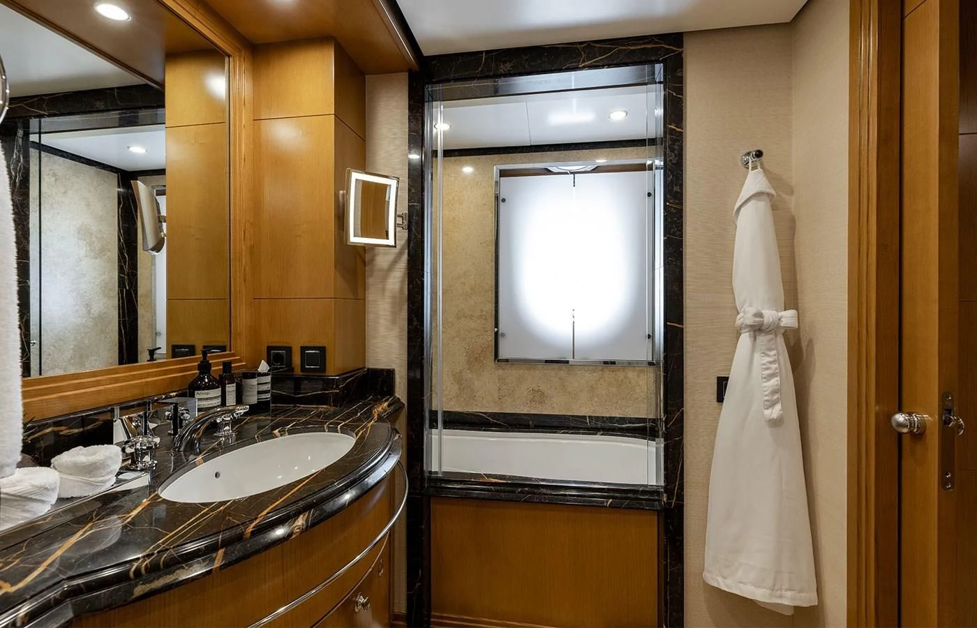 a bathroom with a large mirror aboard TREEHOUSE Yacht for Sale