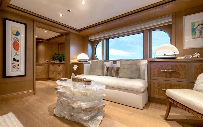 a living room with a large window aboard TREEHOUSE Yacht for Sale