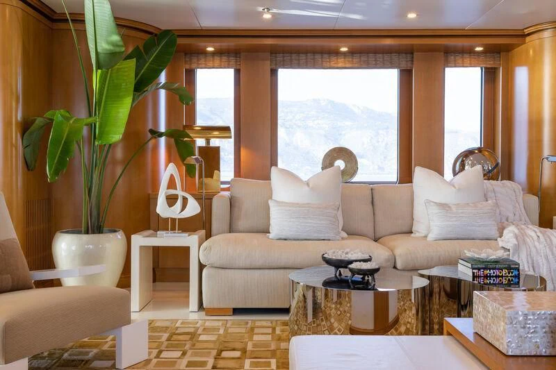 a living room with a couch and a coffee table aboard TREEHOUSE Yacht for Sale