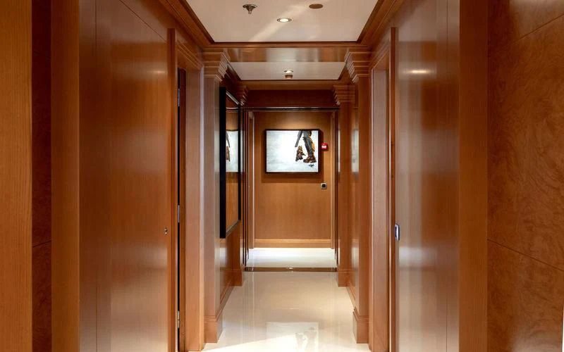 a room with a door and a mirror aboard TREEHOUSE Yacht for Sale