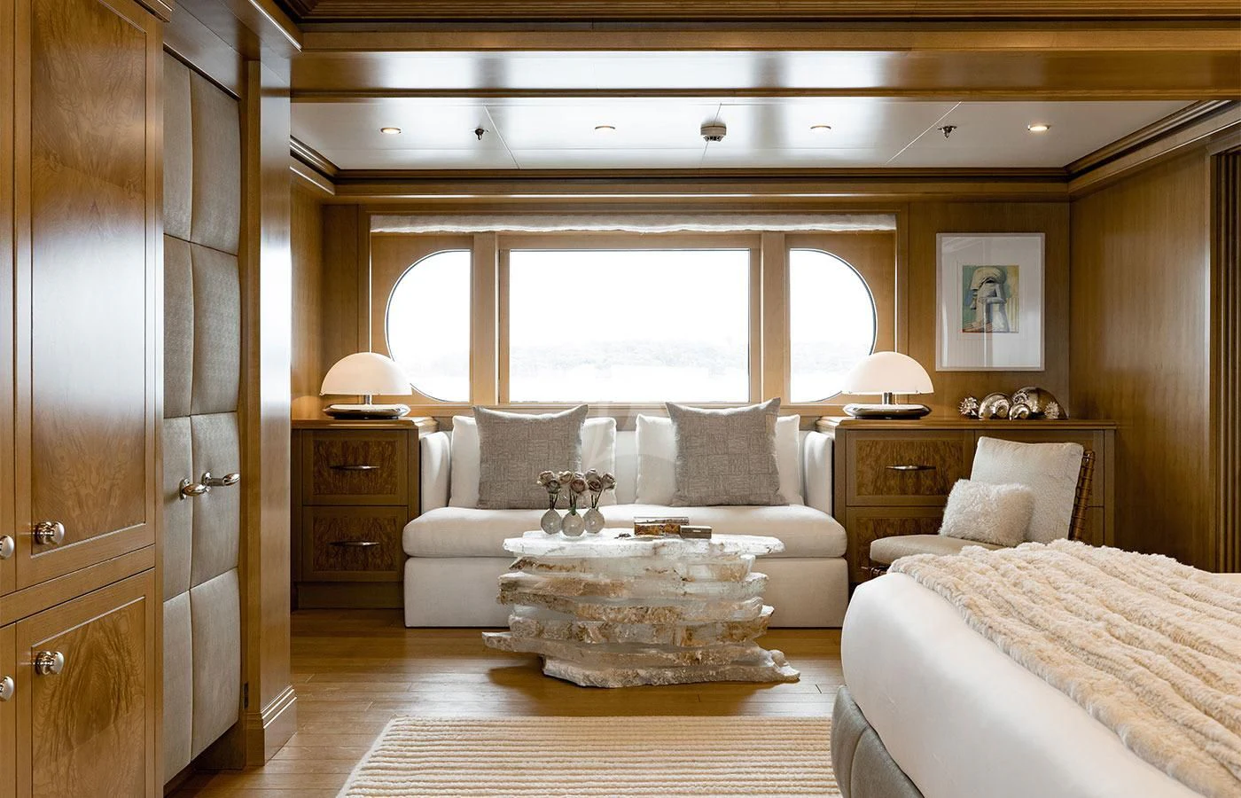 a room with a bed and a table aboard TREEHOUSE Yacht for Sale