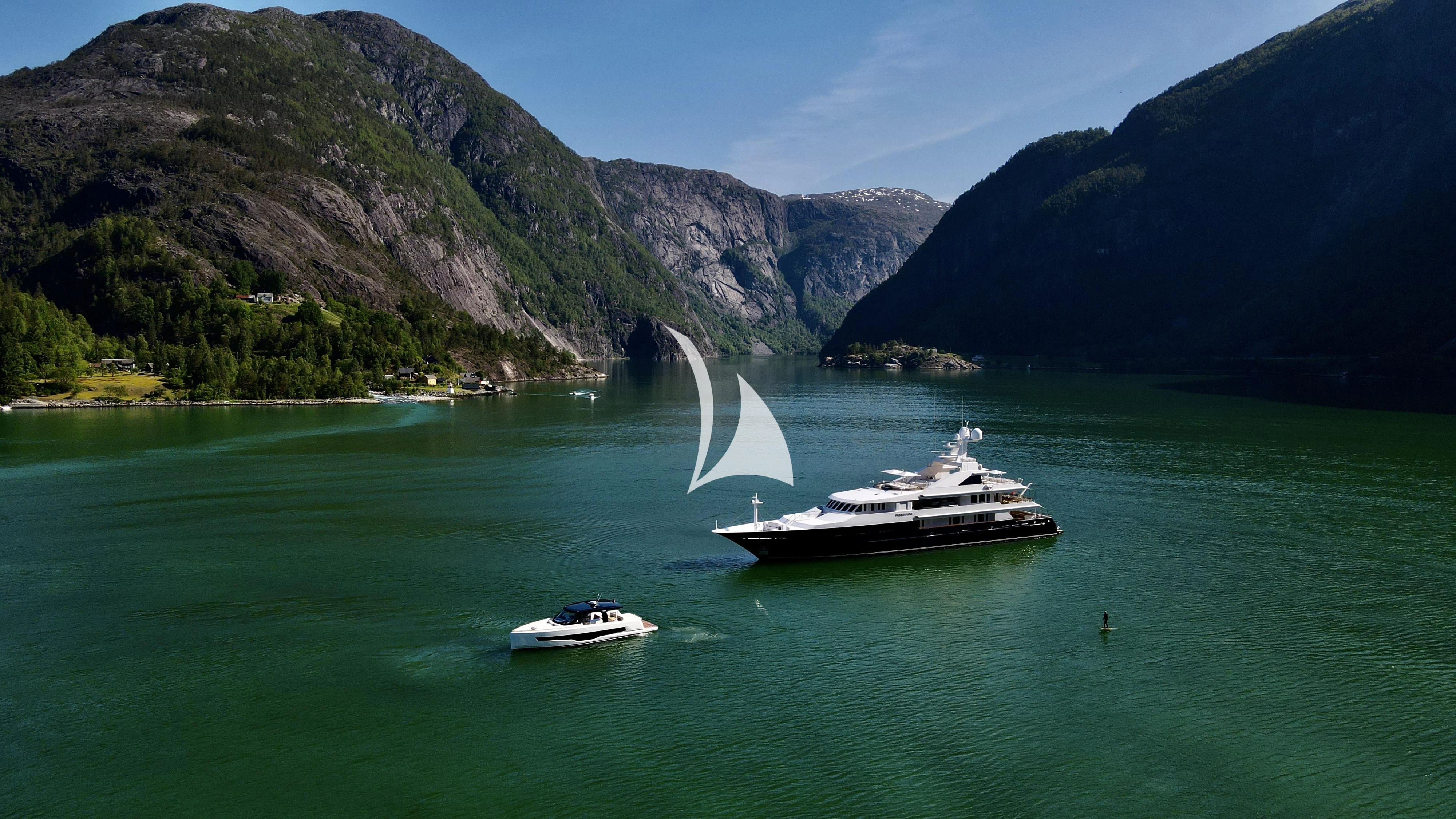a boat sailing in the water aboard TREEHOUSE Yacht for Sale