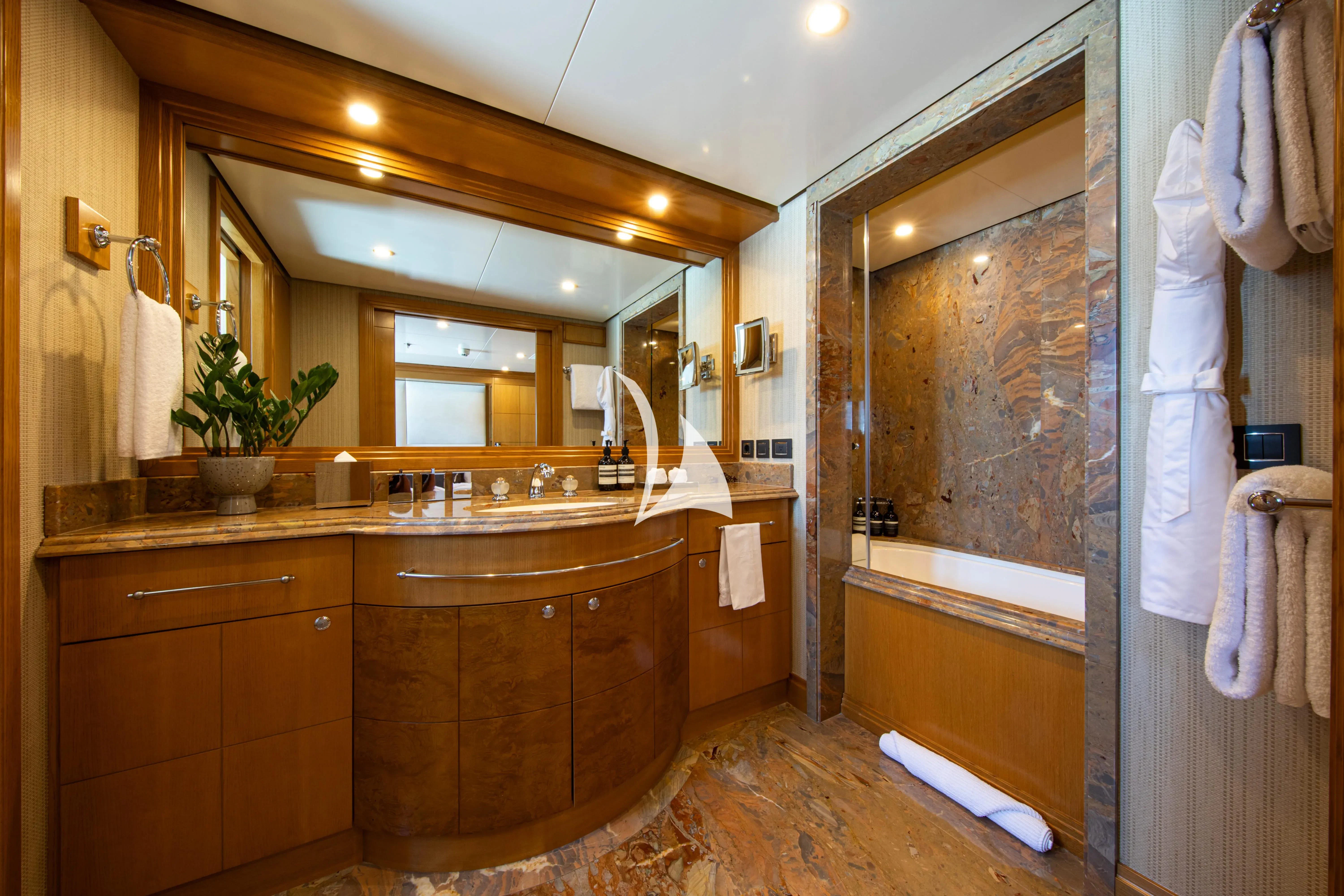 a bathroom with a large mirror aboard TREEHOUSE Yacht for Sale