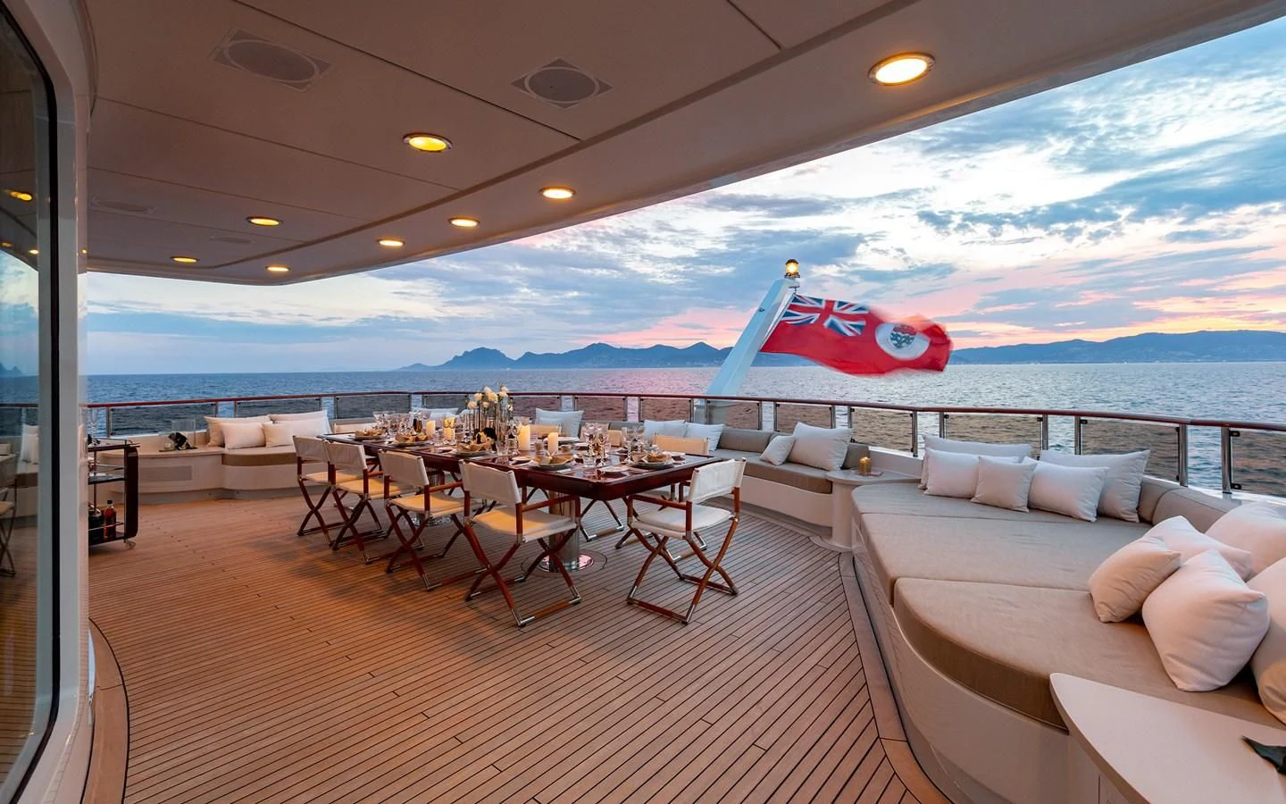 a room with a table and chairs and a large body of water aboard TREEHOUSE Yacht for Sale