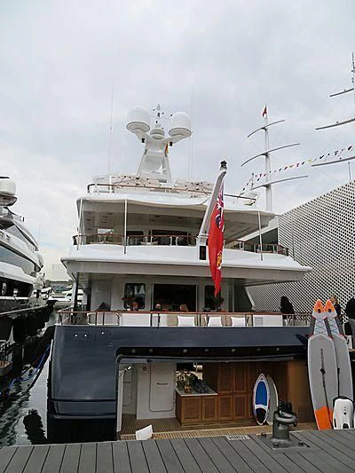 a large boat docked at a pier aboard TREEHOUSE Yacht for Sale