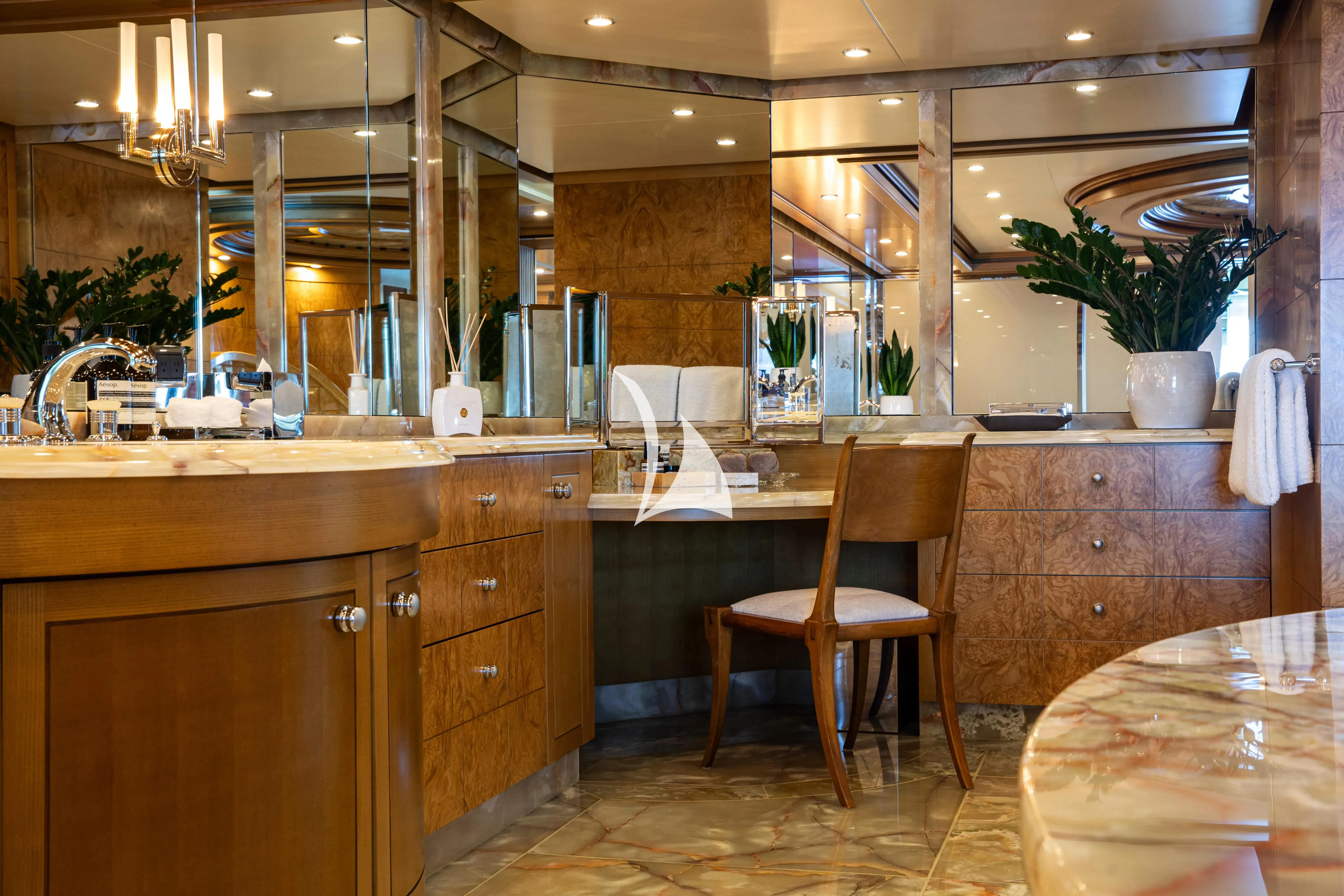 a kitchen with a chair and counter aboard TREEHOUSE Yacht for Sale