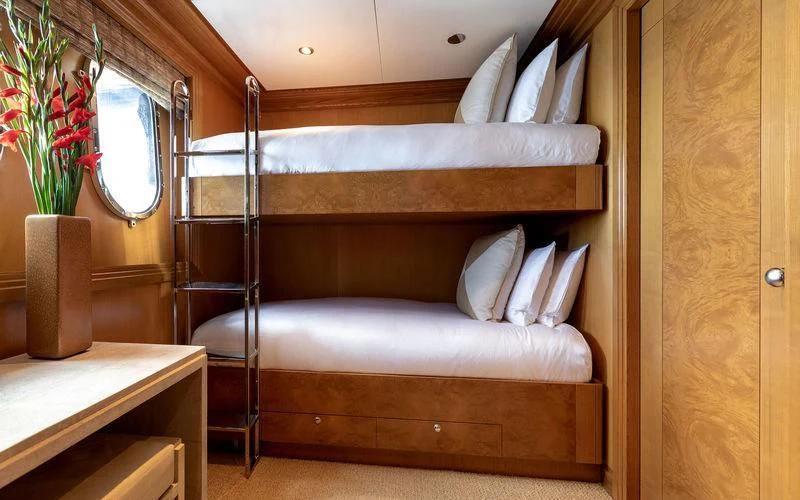 a bed with a wooden frame aboard TREEHOUSE Yacht for Sale