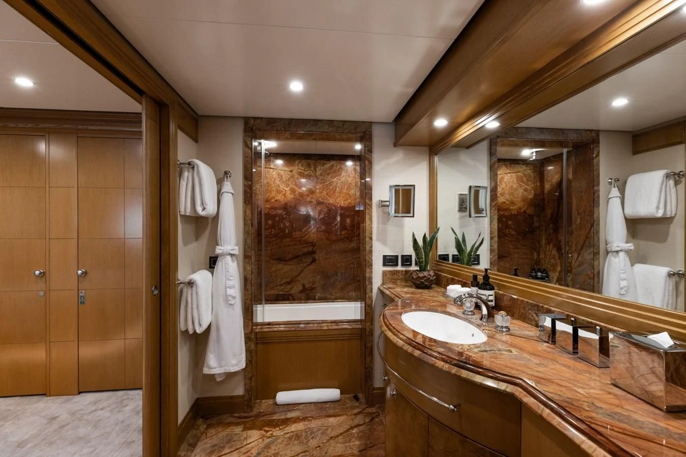 a bathroom with a large mirror aboard TREEHOUSE Yacht for Sale