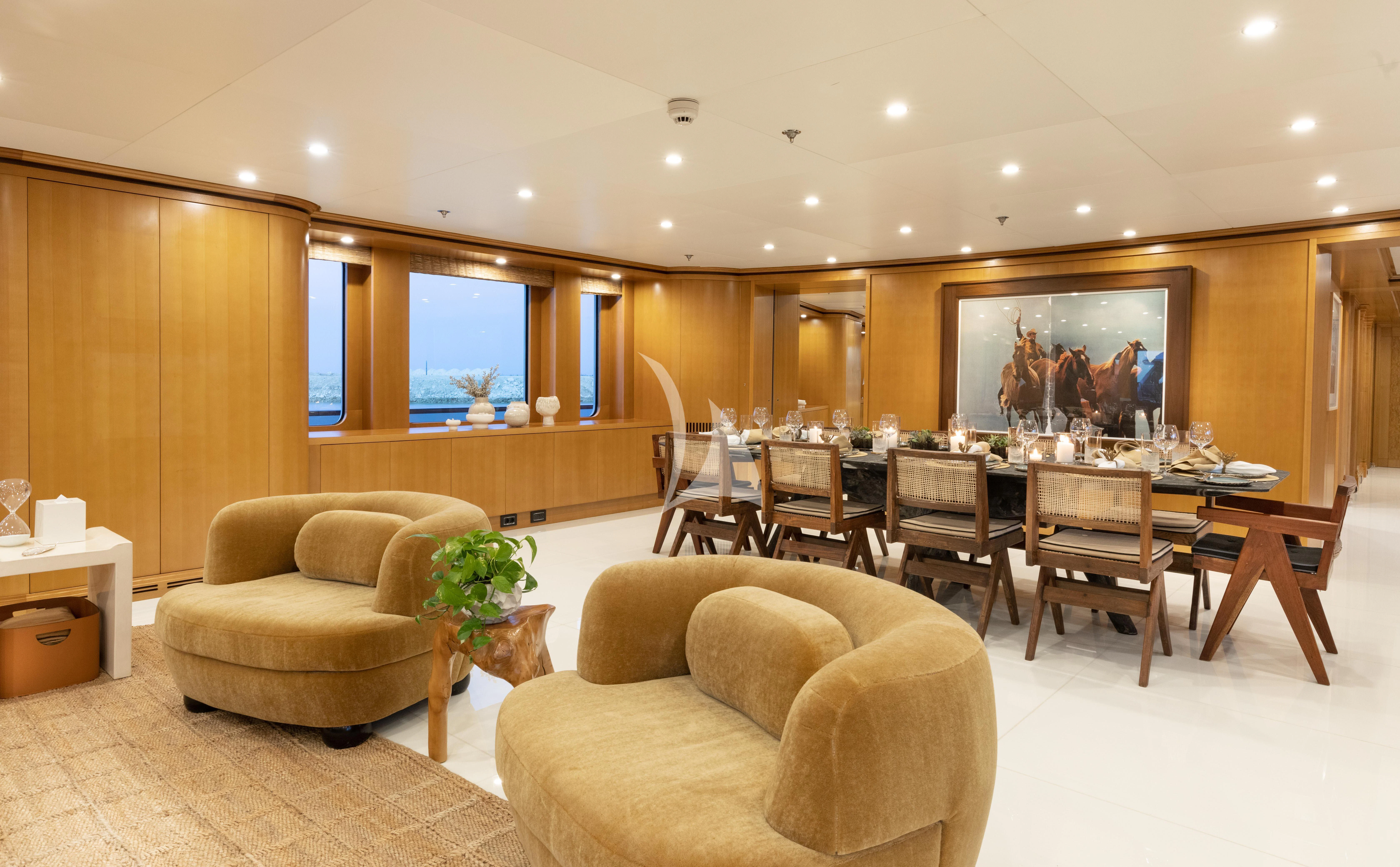 a living room with a couch and a table aboard TREEHOUSE Yacht for Sale