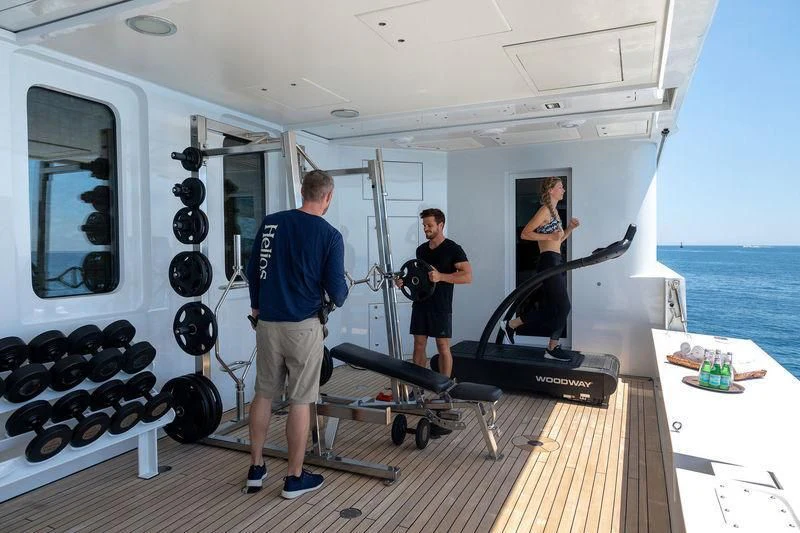 a group of people in a room aboard TREEHOUSE Yacht for Sale