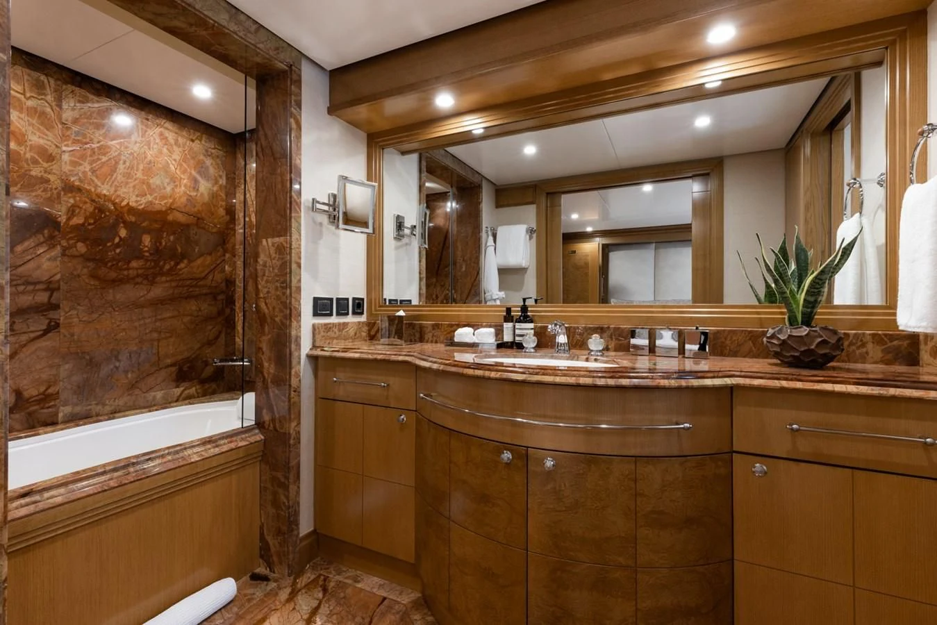 a bathroom with a large mirror aboard TREEHOUSE Yacht for Sale