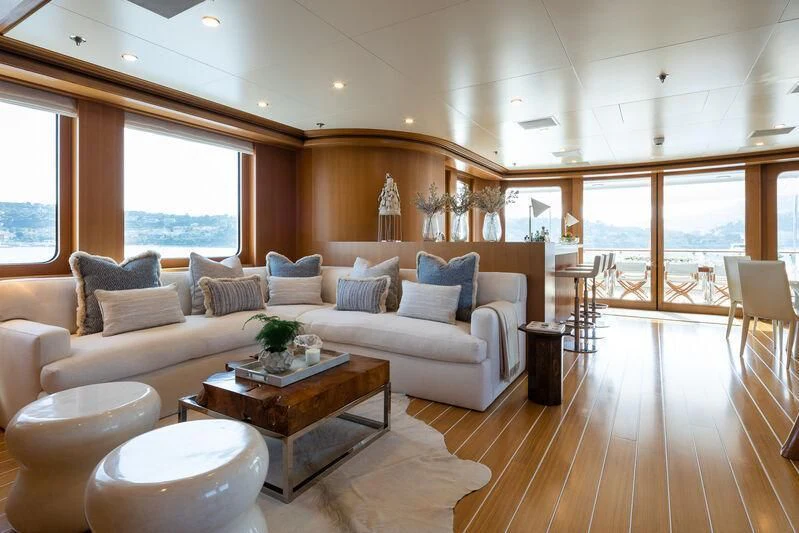 a living room with a large window aboard TREEHOUSE Yacht for Sale