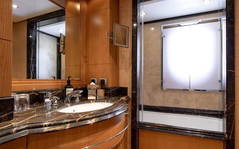 a bathroom with a large mirror aboard TREEHOUSE Yacht for Sale