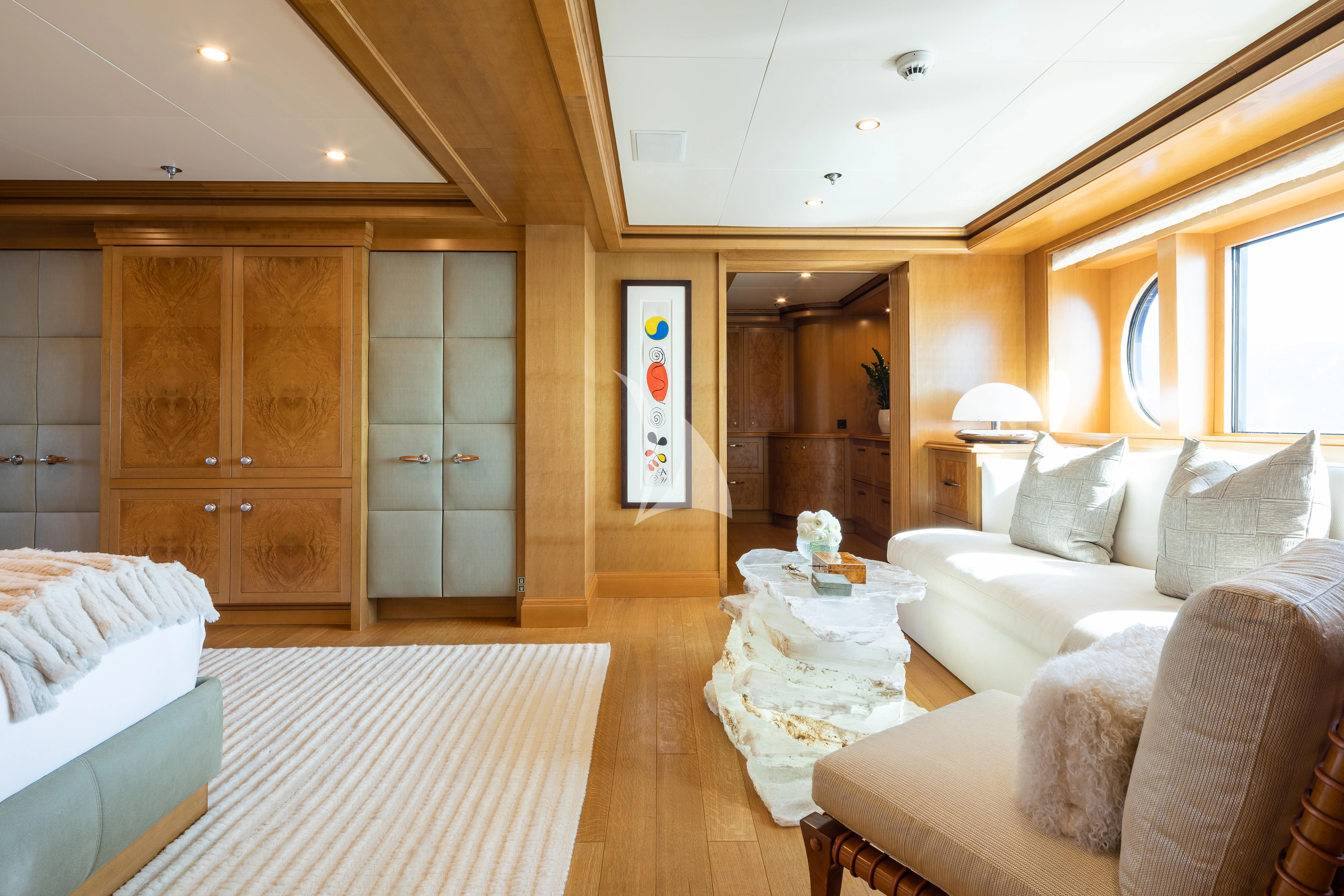 a room with a bed and a table aboard TREEHOUSE Yacht for Sale