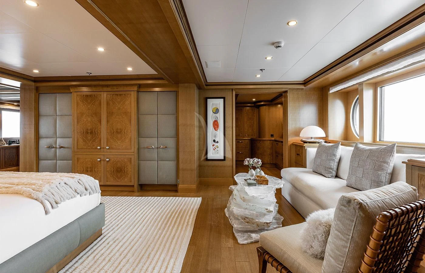 a large room with a bed and a couch aboard TREEHOUSE Yacht for Sale