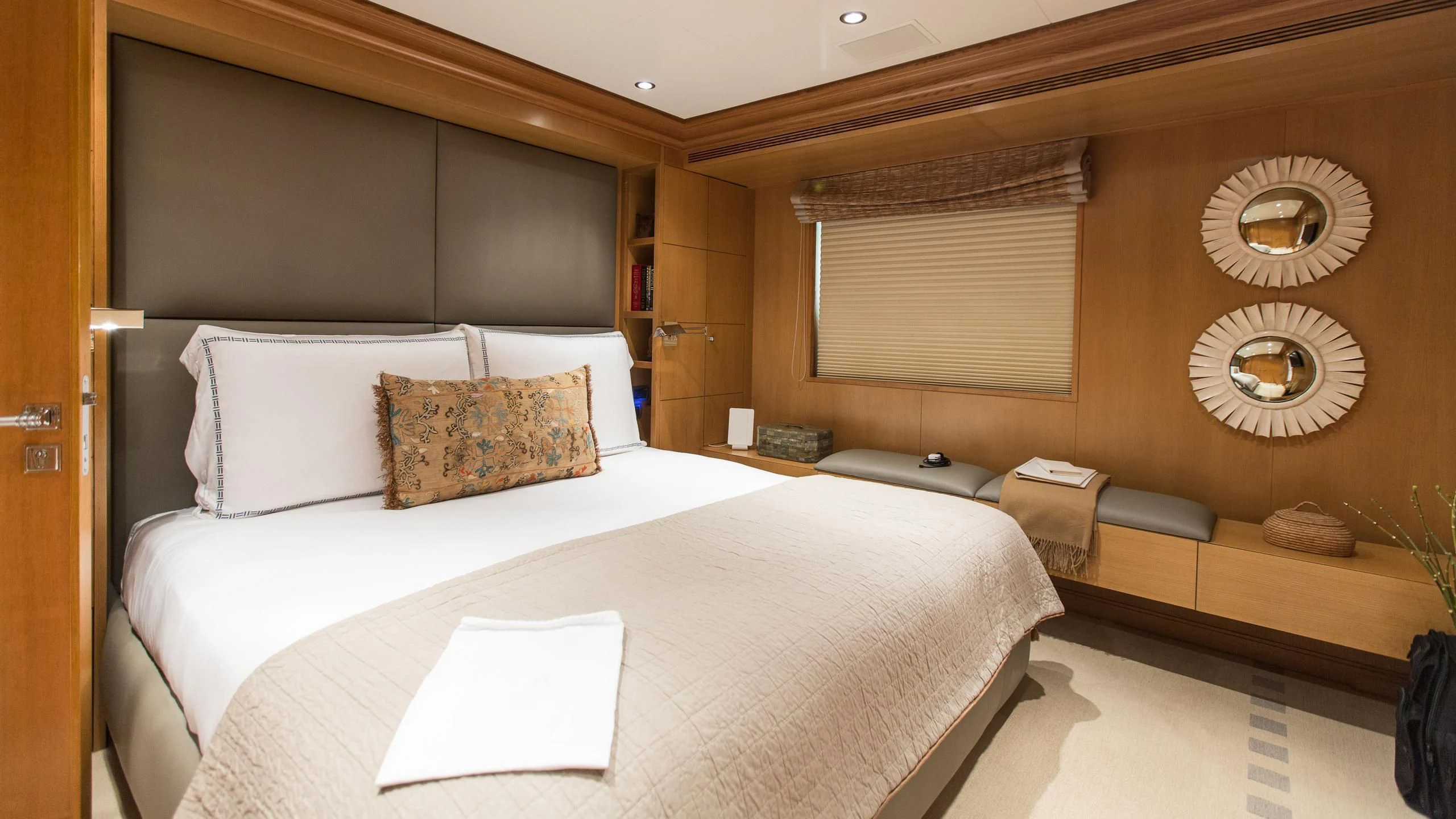 a hotel room with a bed and a window aboard TREEHOUSE Yacht for Sale