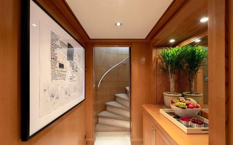 a room with a glass door and a plant on the wall aboard TREEHOUSE Yacht for Sale