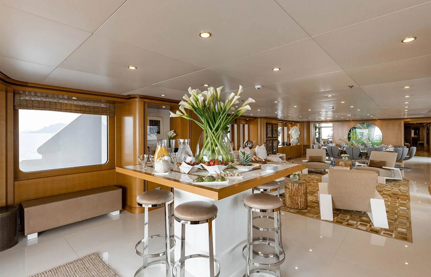 a room with a table and chairs aboard TREEHOUSE Yacht for Sale