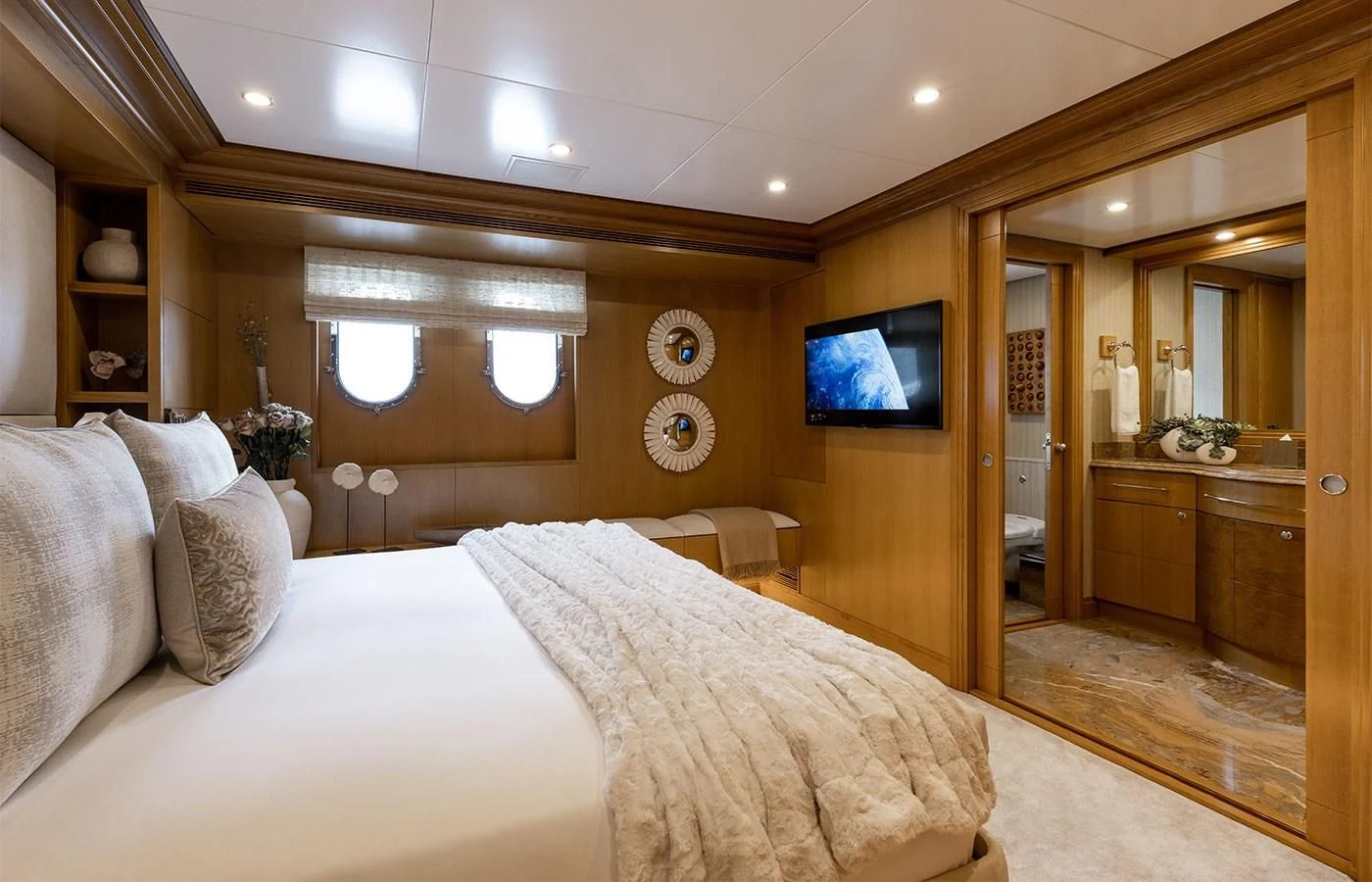 a bedroom with a large bed aboard TREEHOUSE Yacht for Sale