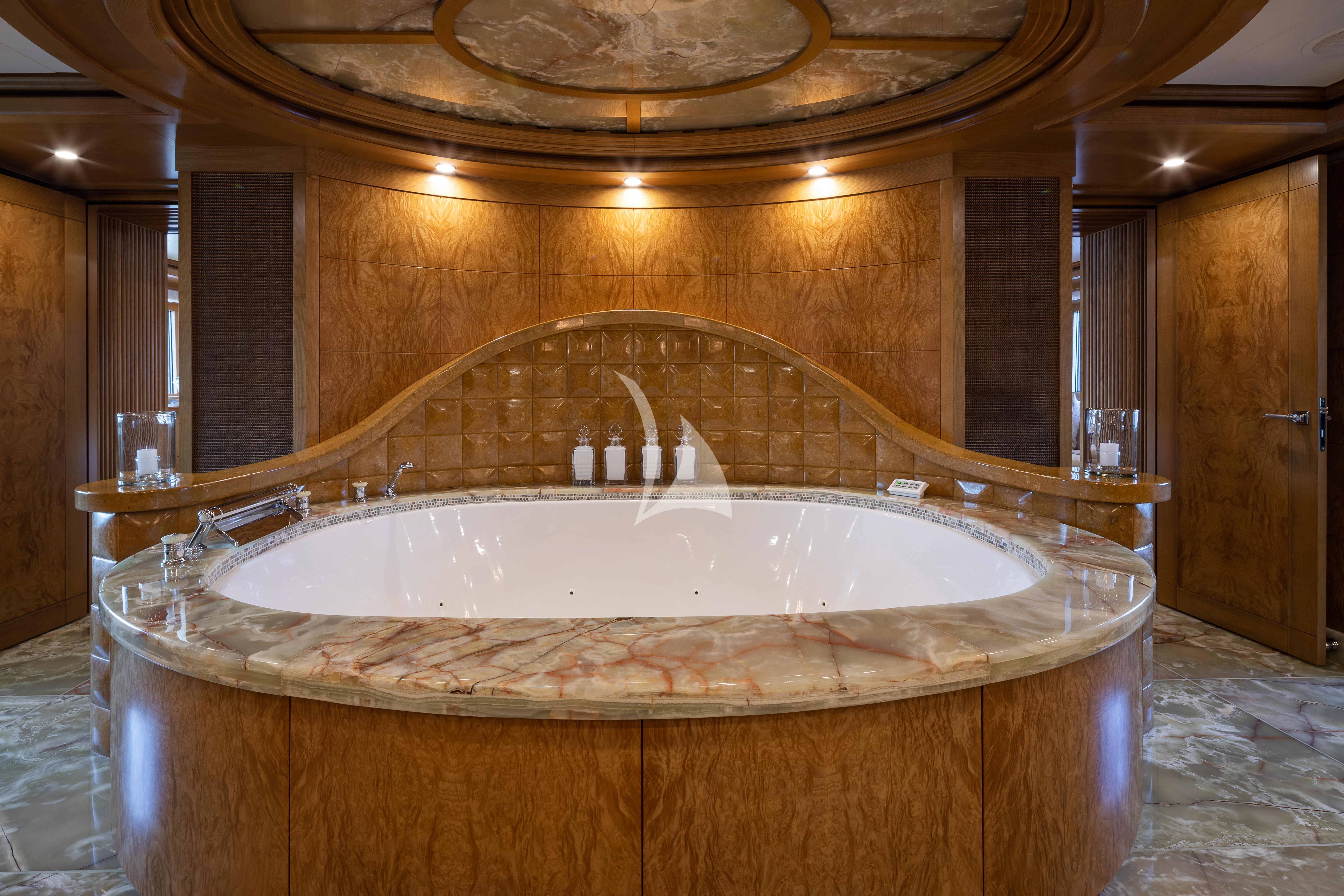 a large bathroom with a large bathtub aboard TREEHOUSE Yacht for Sale