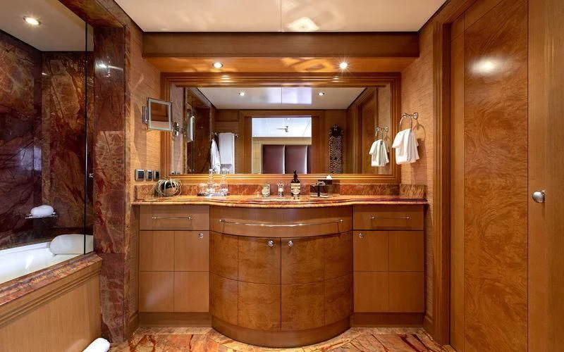 a bathroom with a large mirror aboard TREEHOUSE Yacht for Sale