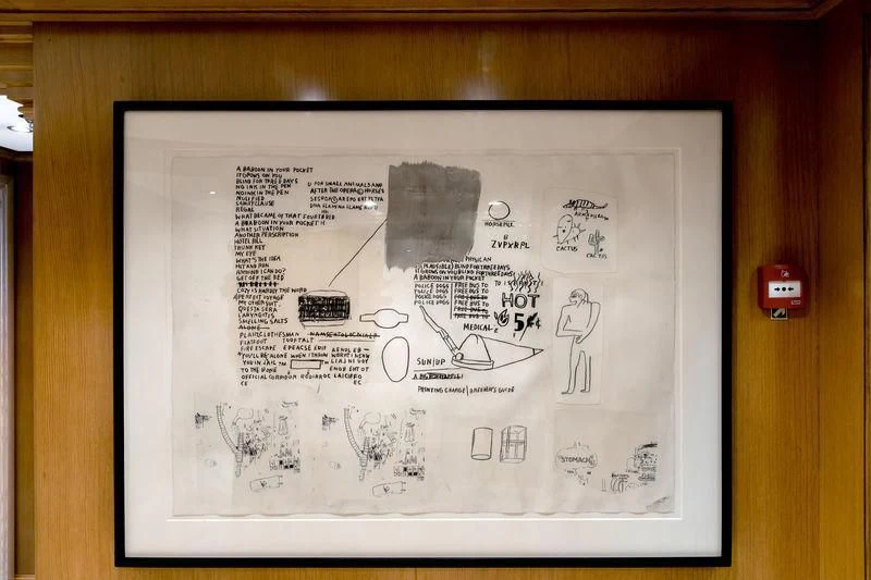 a black framed map on a wooden surface aboard TREEHOUSE Yacht for Sale