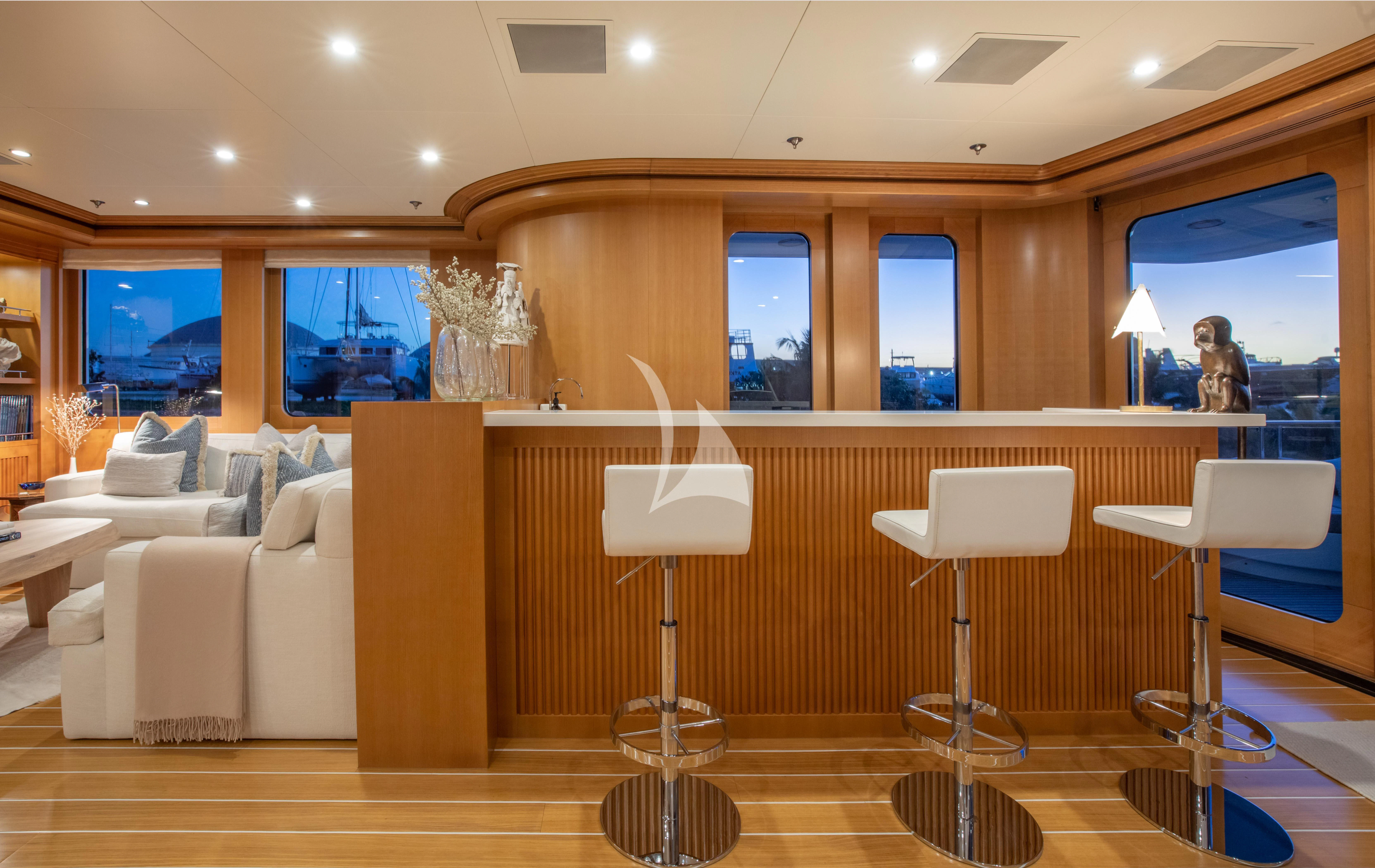a room with a couch and a table and a lamp aboard TREEHOUSE Yacht for Sale