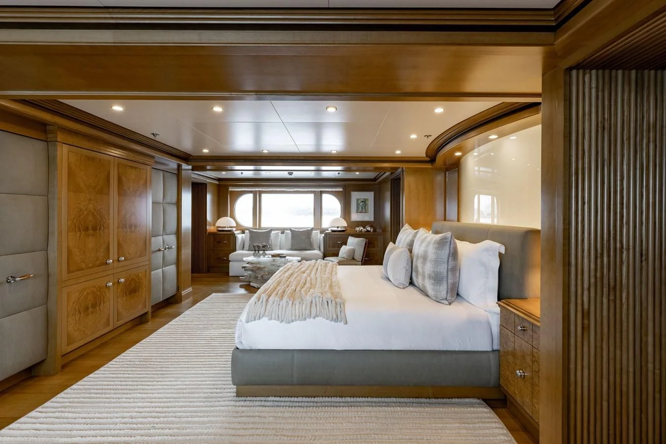 a room with a bed and a chair aboard TREEHOUSE Yacht for Sale