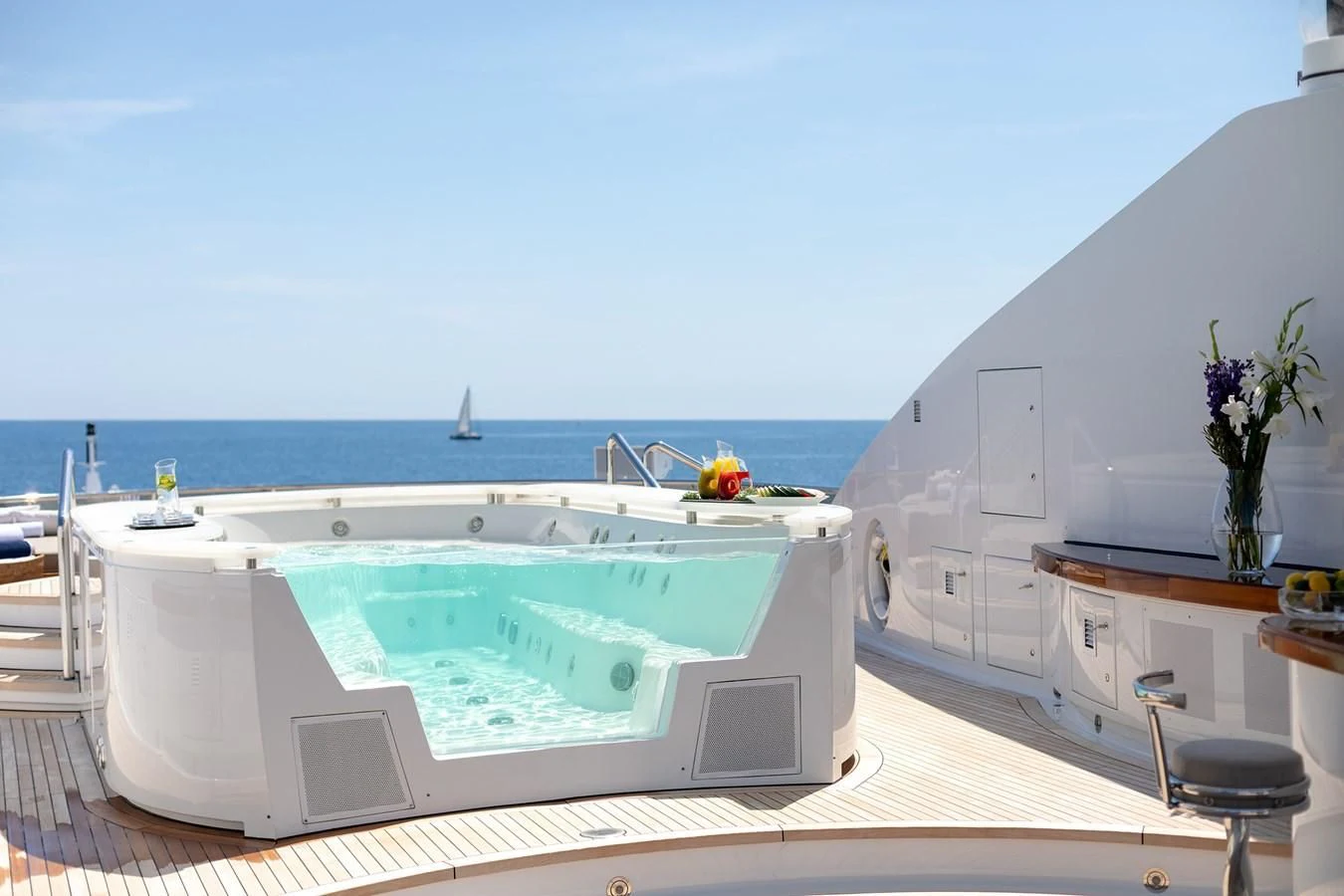 a large white swimming pool aboard TREEHOUSE Yacht for Sale