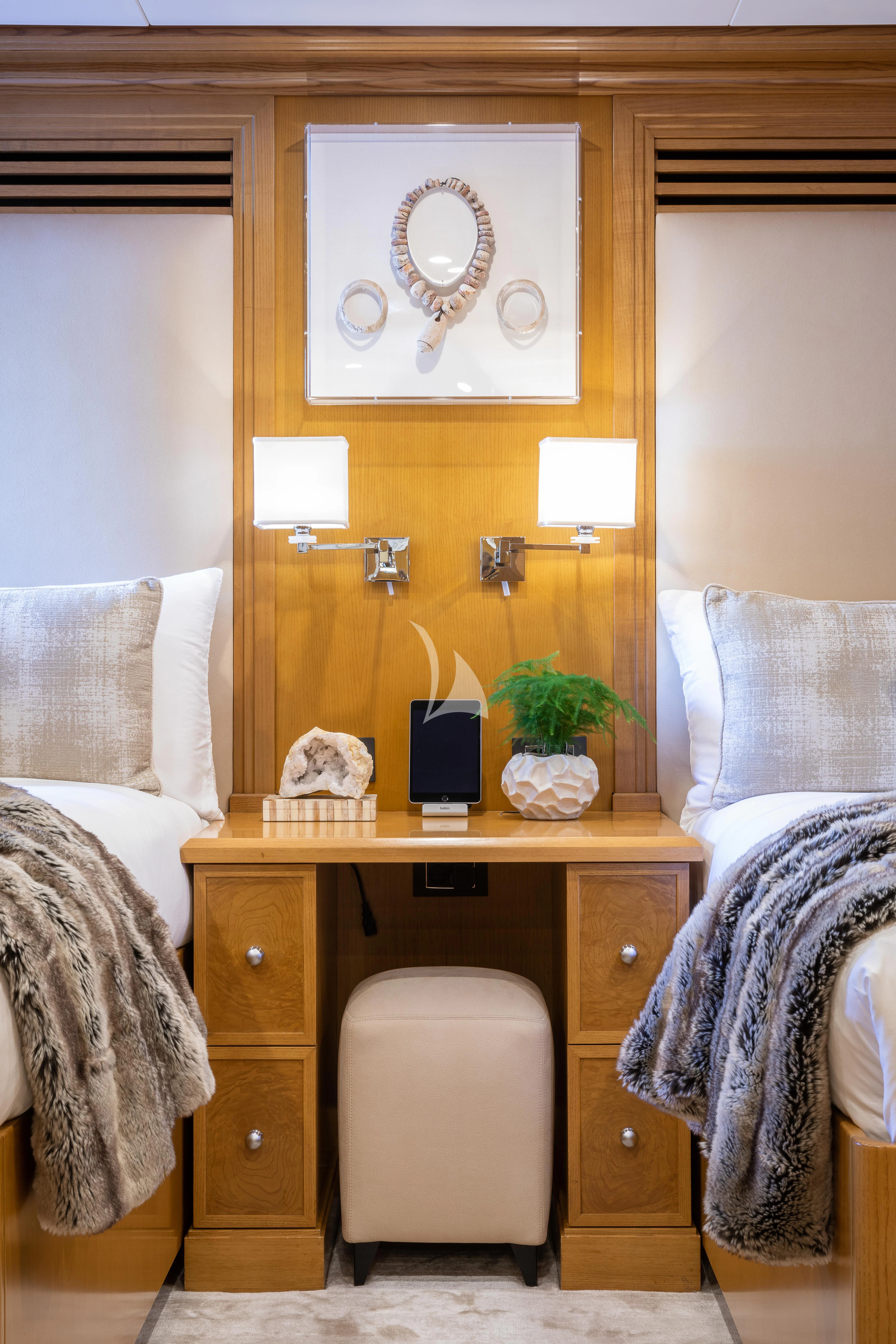a room with a desk and a bed aboard TREEHOUSE Yacht for Sale