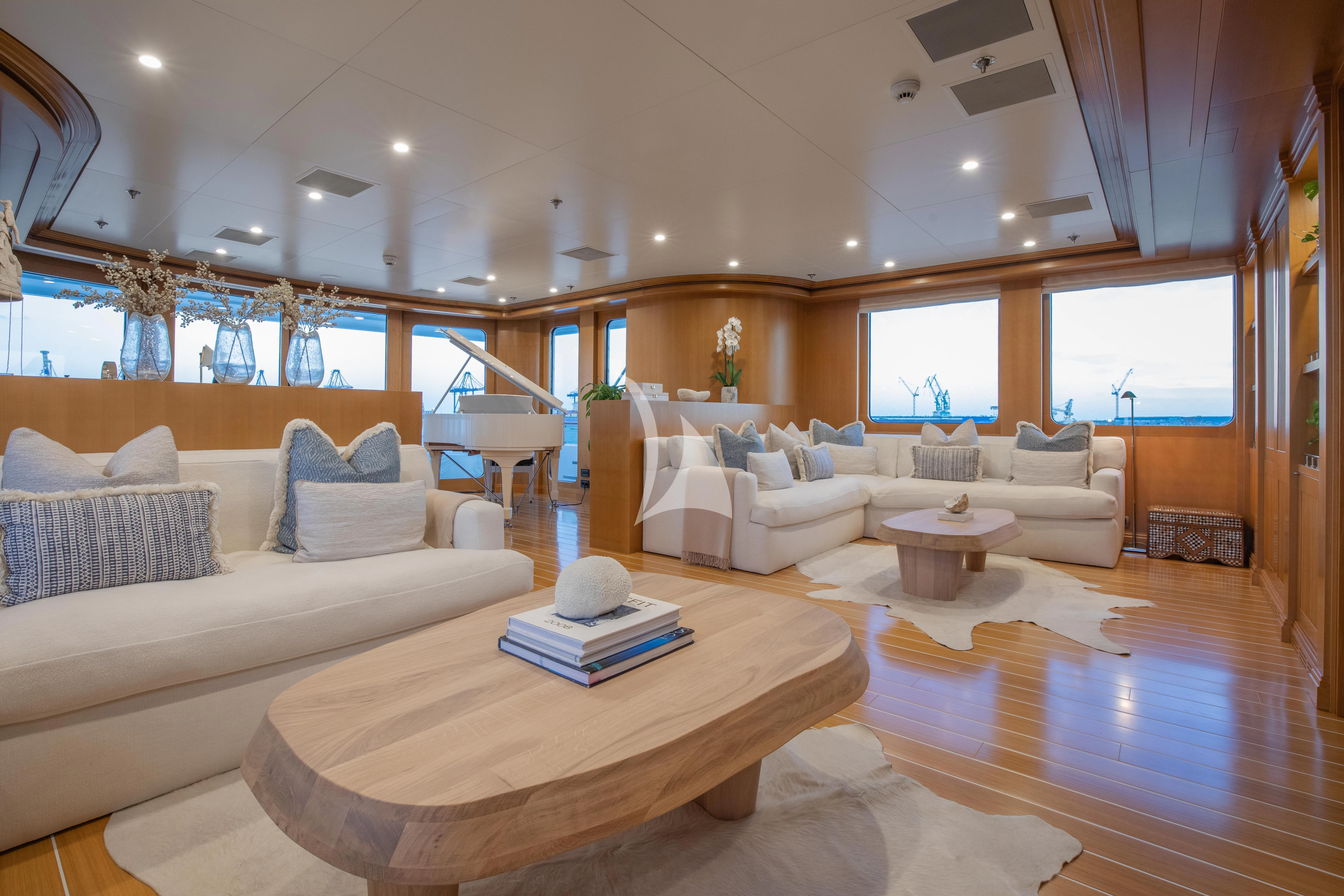 a living room with a large window aboard TREEHOUSE Yacht for Sale
