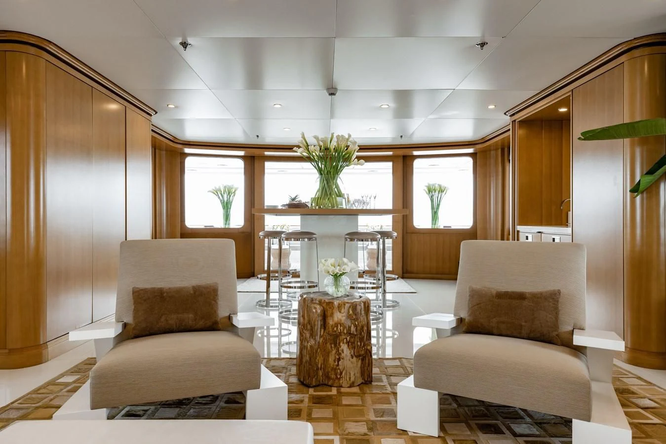 a living room with a table and chairs aboard TREEHOUSE Yacht for Sale