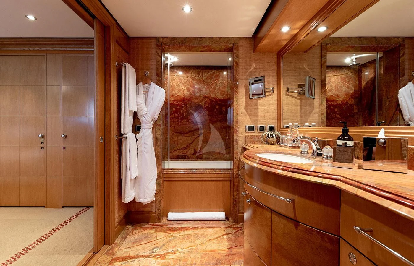 a bathroom with a large mirror aboard TREEHOUSE Yacht for Sale