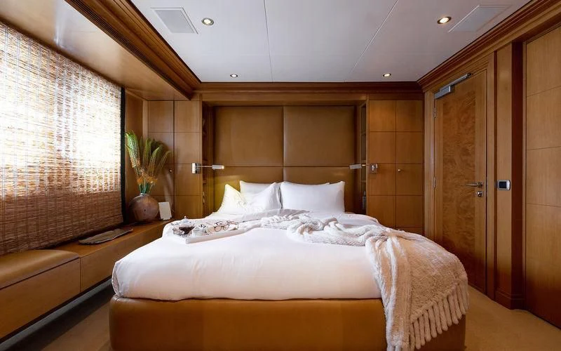 a bed in a room aboard TREEHOUSE Yacht for Sale
