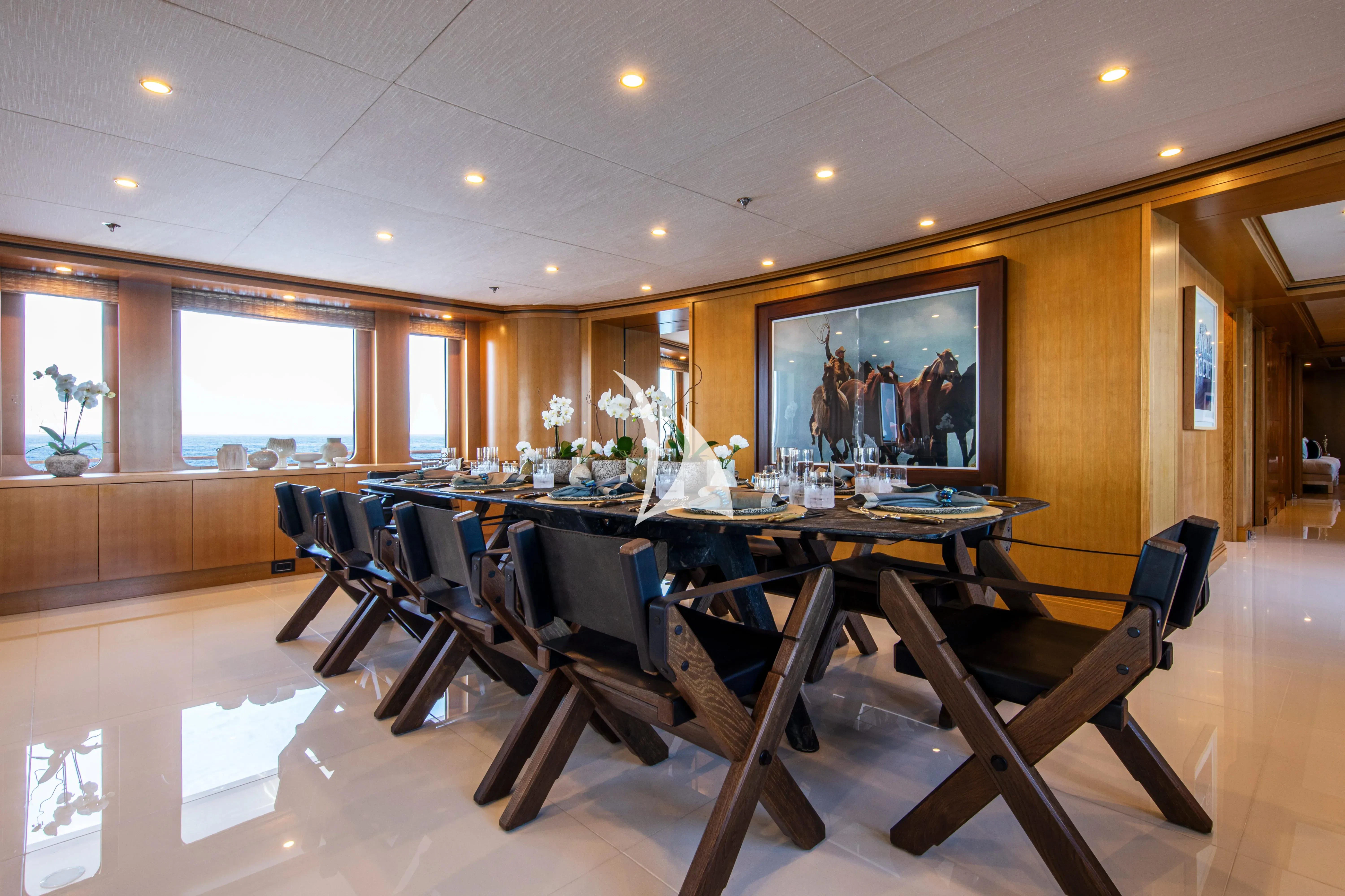 a room with a table and chairs aboard TREEHOUSE Yacht for Sale