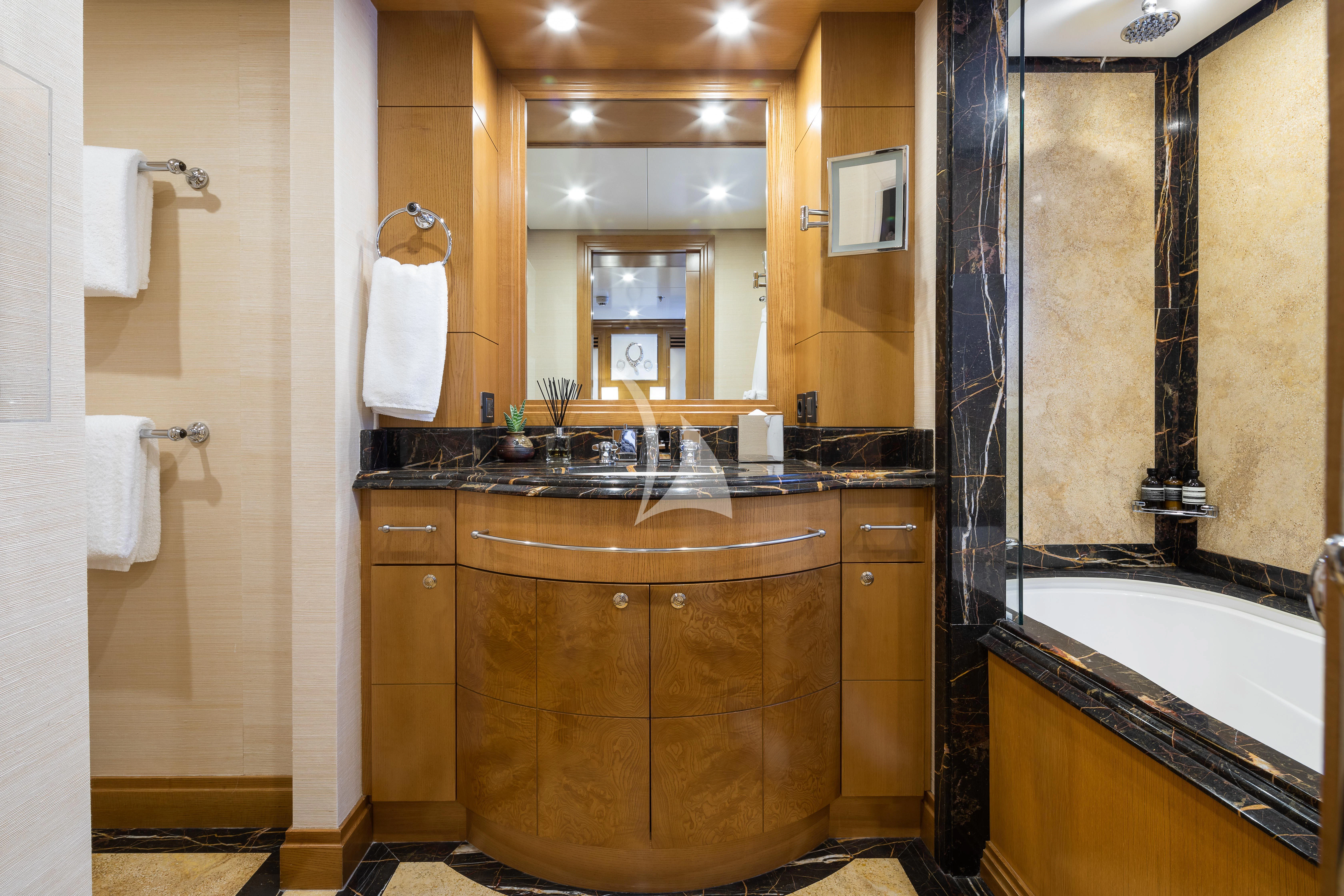 a bathroom with a sink and a mirror aboard TREEHOUSE Yacht for Sale