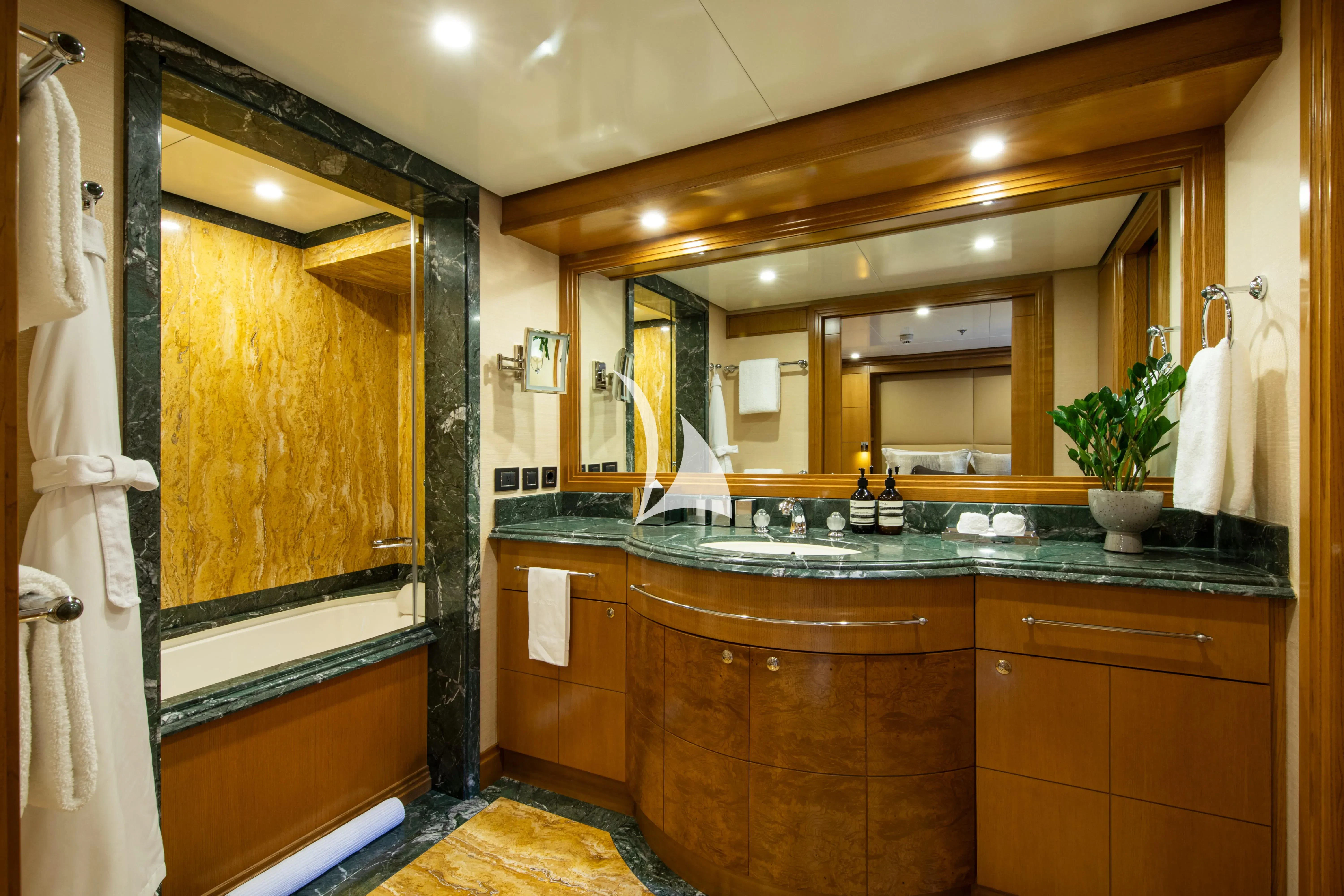 a bathroom with a large mirror aboard TREEHOUSE Yacht for Sale