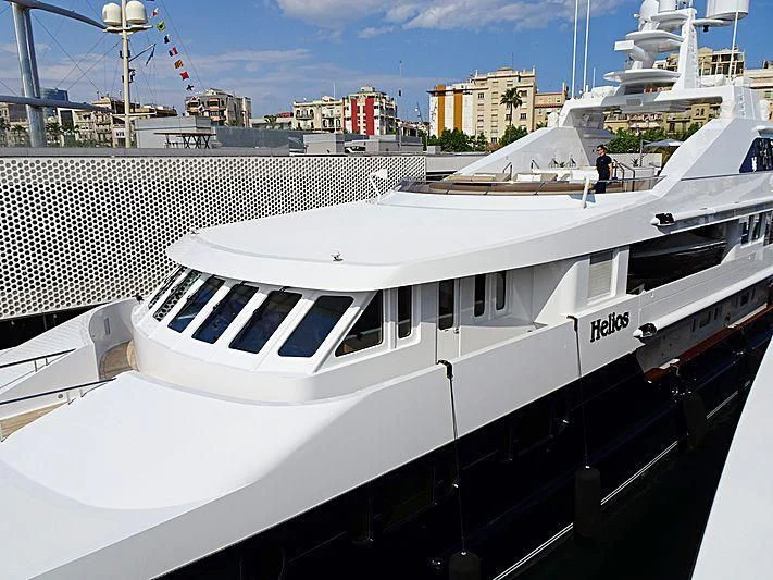 a white yacht in a harbor aboard TREEHOUSE Yacht for Sale