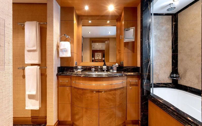 a bathroom with a sink and a mirror aboard TREEHOUSE Yacht for Sale