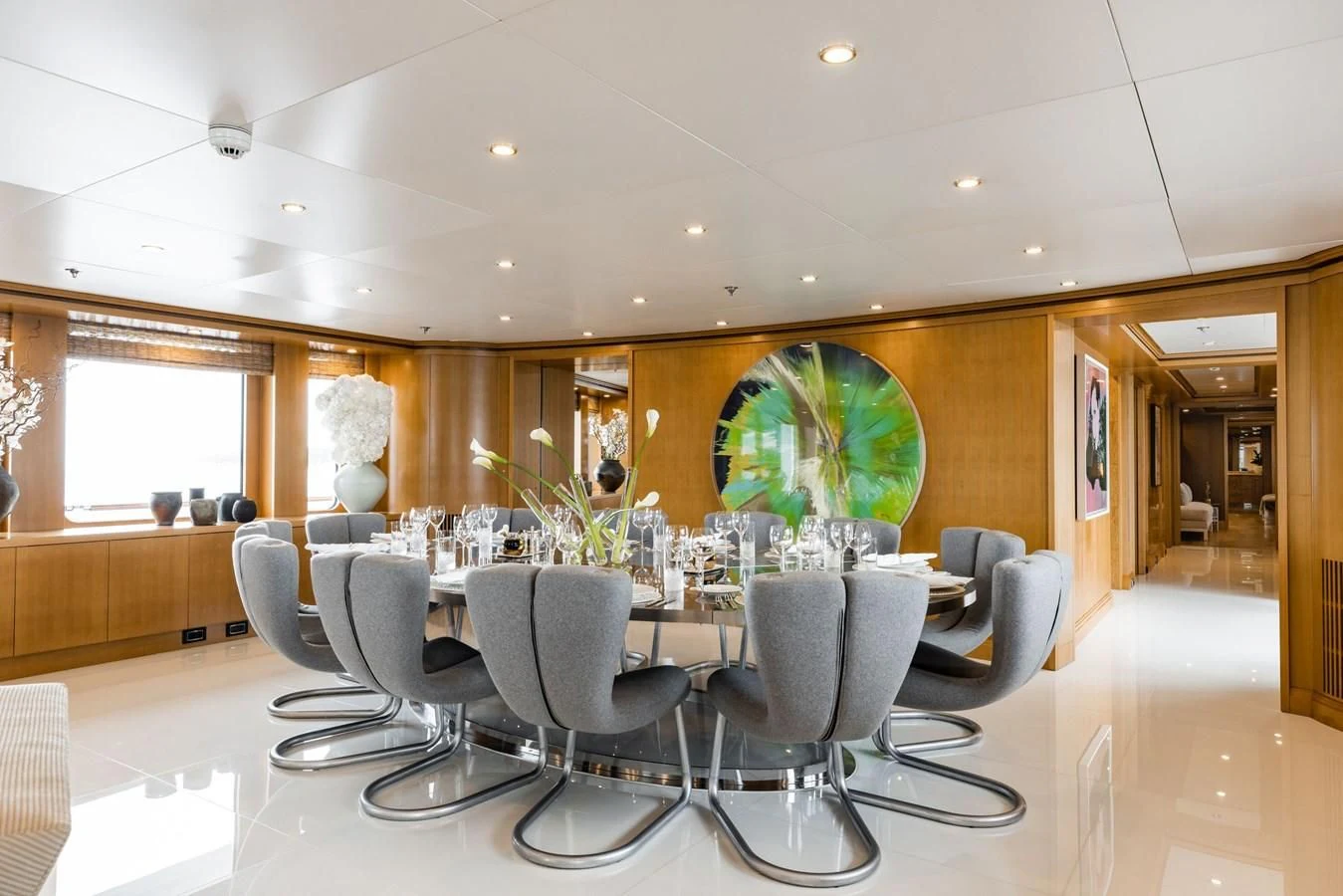 a large room with chairs and a table aboard TREEHOUSE Yacht for Sale