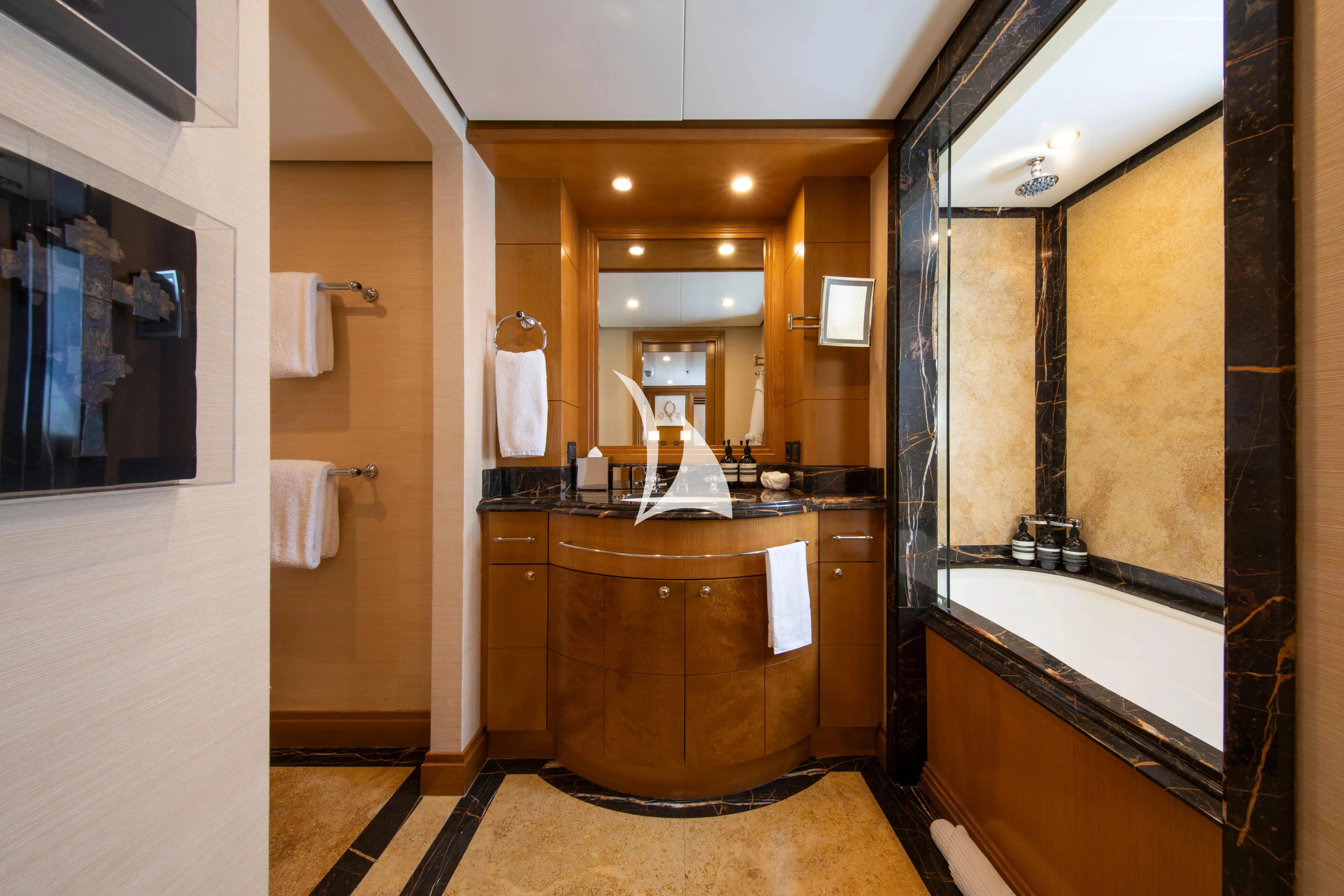 a bathroom with a large mirror aboard TREEHOUSE Yacht for Sale