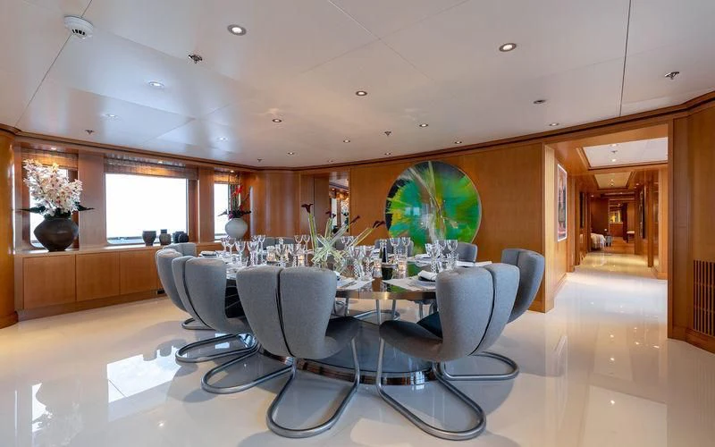 a large room with chairs and a table aboard TREEHOUSE Yacht for Sale