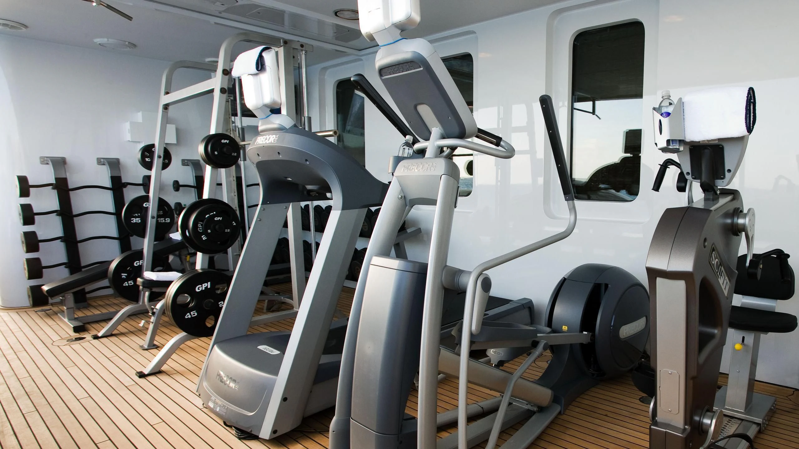a gym with large weights aboard TREEHOUSE Yacht for Sale