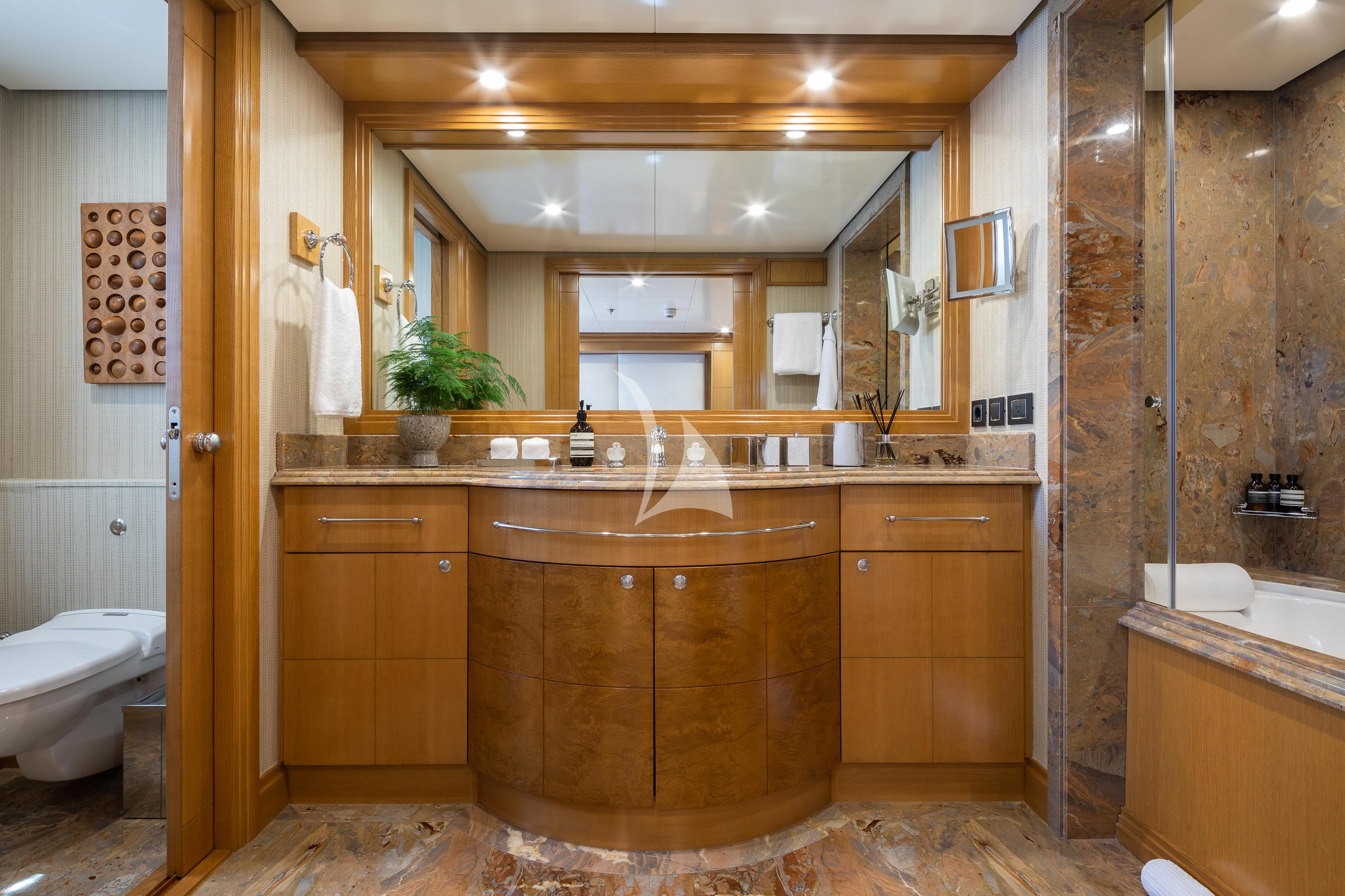 a bathroom with a large mirror aboard TREEHOUSE Yacht for Sale